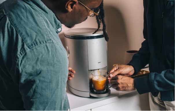 Man brewing coffee with Spinn Original coffee maker