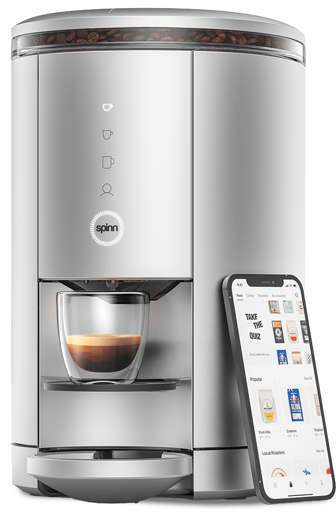 Phone with Spinn app opened next to the Spinn coffee maker”